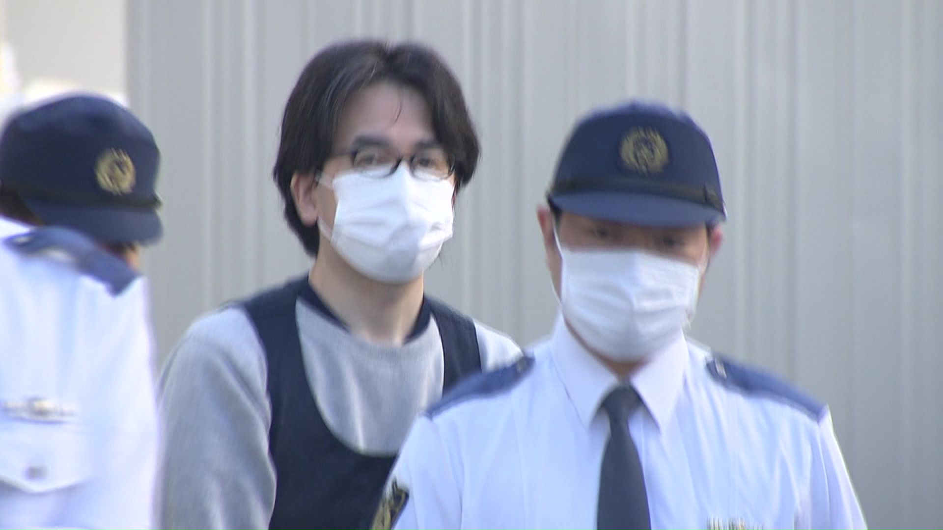 送検される対馬光容疑者