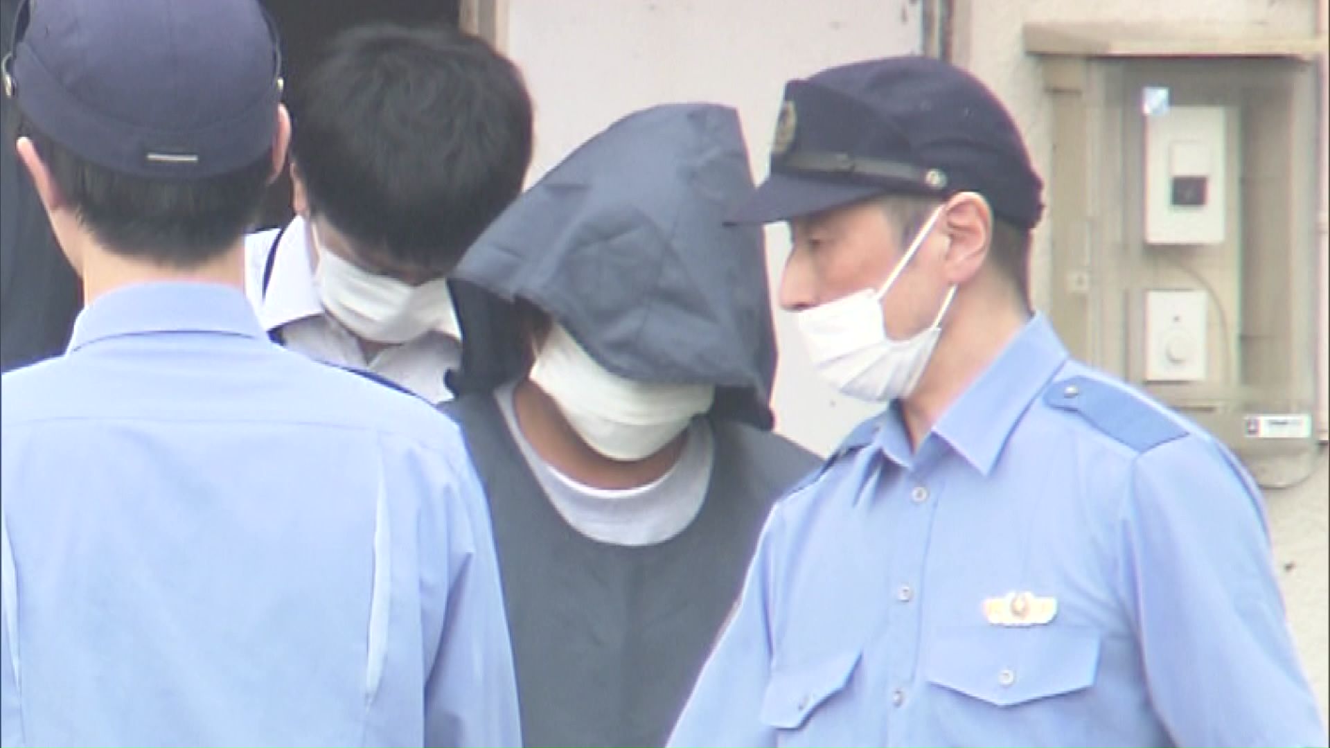 送検される高谷正雄容疑者