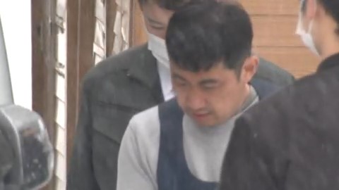 送検される宮西被告
