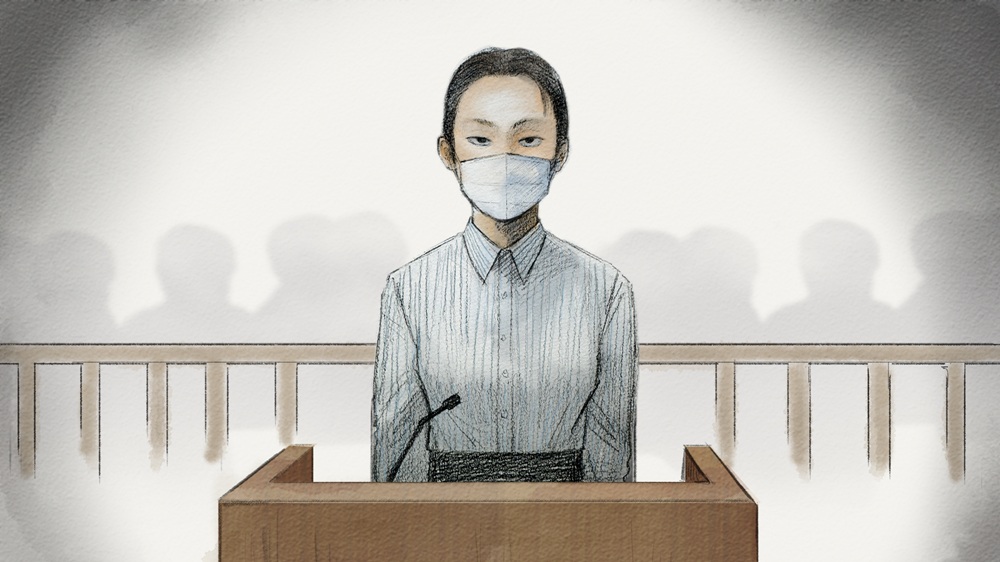 証言台に立つ内田被告